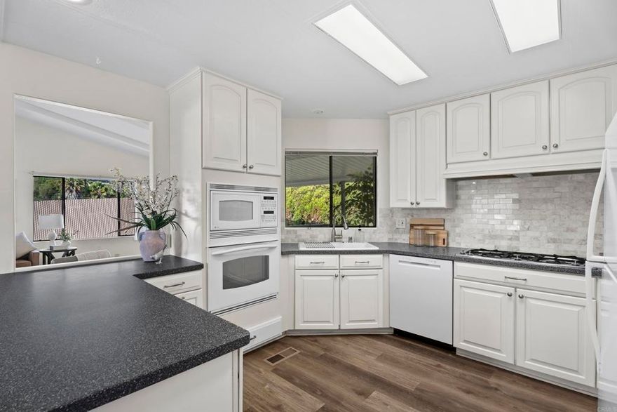 Beautifully updated 2BR/2BA + office/den, 1,344 sq. ft. home in Palomar Estates West 55+ community. Features include wood vinyl throughout, upgraded kitchen with newer appliances, large walk-in closet, fresh paint inside/out, new light fixtures, new front porch, refreshed landscaping, and new carpet on stairs & back porch. Open, light-filled floor plan, 2-car carport, and large storage shed. Resort-style amenities: pool, spa, fitness, pickleball, putting green & more. Prime San Marcos/Carlsbad location with low space rent!
