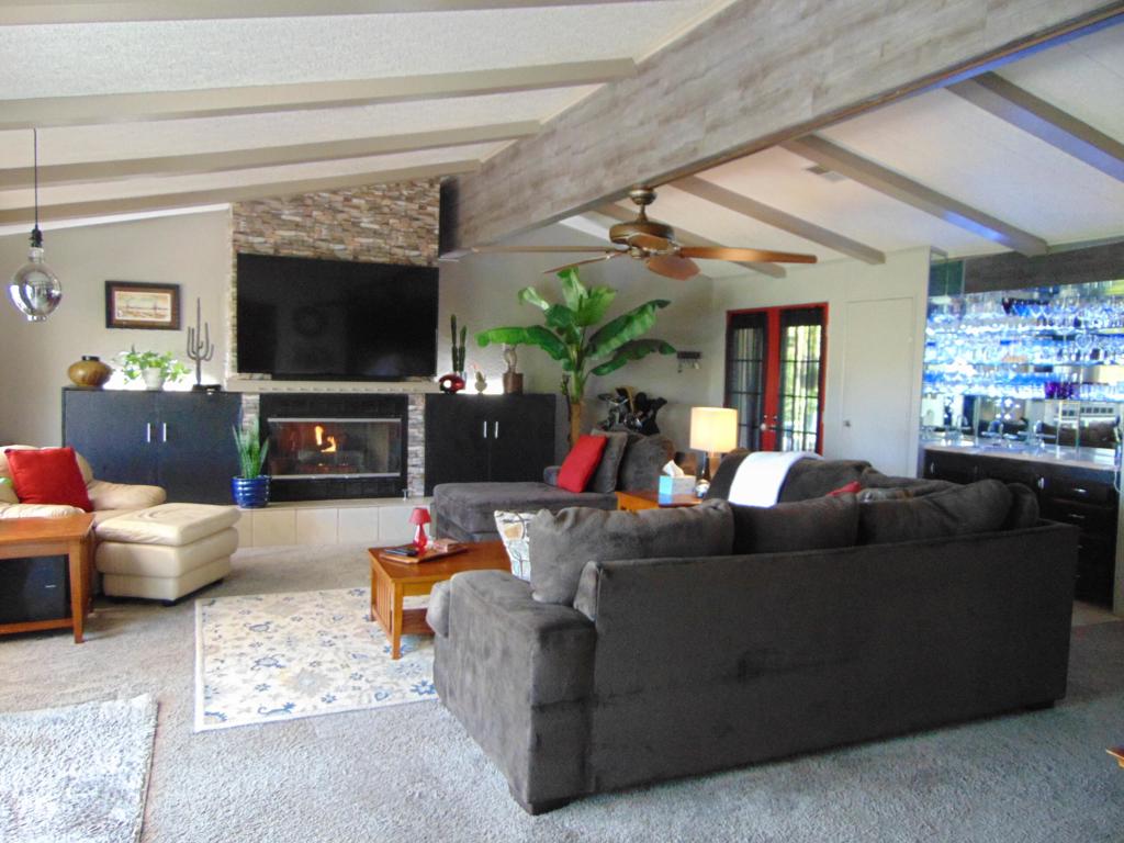 You can have it all! Check this place out...This unique floor plan boasts over 2200 square feet with two nice sized bedrooms as well as two nice sized bathrooms. This home also has a large den area as well. Kitchen, dining, and living areas are extremely spacious! This includes a beautiful large gas fireplace for those chilly nights. Home has new vinyl plank flooring as well as newer carpet. Home feels very spacious throughout. Step out onto your private back patio where you will enjoy spectacular views of two different fairways, to include a pond with fountain, as well as snow covered mountains! This patio is one of the best in Suncrest Country Club. Covered front entry is a great place to enjoy your coffee in the morning sun. You cannot beat the sunsets from the back patio each evening as you are enjoying happy hour. Suncrest is also known as FUNcrest!! Come see this today, as it's priced to move.