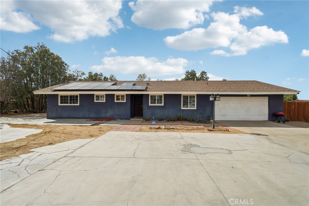 Gorgeous 3 bed, 2 bath single level home with 1,334 Sqft of Living Space and sitting on a 43,560 Sqft Lot, with an attached 2-Car Garage, driveway parking for 10+ Cars, plus a Carport, and Leased Solar Panels. The interior is open and spacious with with a neutral paint scheme, and dual pane windows. The large living room opens to the dining area and the updated kitchen which features granite counters, white cabinetry, tile backsplash, and stainless steel appliances. This home features 3 bedrooms with a large primary bedroom that has a private bathroom, and there is also a hall bathroom for the secondary bedrooms. This home also features a bonus room - that would be great for an office, storage area or work out room. Enjoy the fenced backyard and there is also an Acre of space to make your own! Conveniently located near shopping, dining, and not far from 395 Hwy.