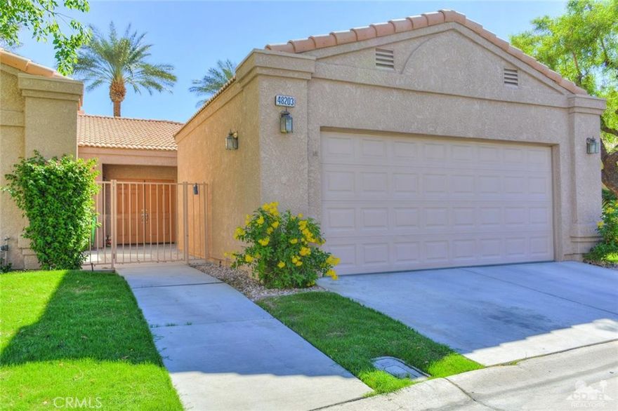 Located in the guard gated lake community of Laguna de la Paz. Spacious 3 bedroom and 2 full baths, 1950 sq.ft with 20 tile throughout. Large living room with fireplace and separate dining room. Updated gourmet kitchen with granite counter tops, stainless steel appliances and breakfast nook. Large master with walk in closet, double vanity, shower and separate soaking tub. The other two bedrooms are a nice distance from master and share a full bath with double vanity. The living room, master and kitchen all open to the lush private wrap around patio with multiple sitting areas and mountain view. Great for entertaining. The community has 15 pools, 16 spas, 7 acre lake with electric and paddle boats, 5 tennis courts, workout room, his and her sauna, shuffleboard, bocce ball, walking trails, catch and release fishing and clubhouse. Located close to some of the Desert's best golf, tennis, dining, shopping, entertainment and casinos.