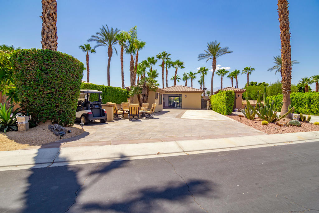 Lot 386 offers a solid blend of comfort, functionality, and flexibility. The tile-roof shade structure features pocketing glass doors, a TV, fireplace, Sonos soundbar, electric shades, and a full-size washer and dryer. The outdoor kitchen is fully equipped with granite countertops, a full-size fridge, oven and range, microwave, dishwasher, wine fridge, and deep sink. A separate casita with full bath adds convenience for guests or owners.The fully enclosed backyard features an above-ground spa--ideal for relaxing or letting pets roam freely. At the front of the lot, you'll find a built-in BBQ, beverage fridge, and fire pit. The spacious paver layout provides room for a 45' coach, two vehicles, and a golf cart.Motorcoach Country Club exclusively accommodates Class A motorhomes from 30' to 45'. Due to zoning, on-site structures are not considered dwellings, and overnight stays inside them are not permitted. MCC's annual Food & Beverage minimum is $2,080.Owners enjoy access to world-class amenities including a 9-hole golf course, scenic waterways, a renovated restaurant and bar, three pools, pickleball and tennis courts, a fitness center, and separate men's and women's saunas.Lot 386 is move-in ready and offered with owner financing.