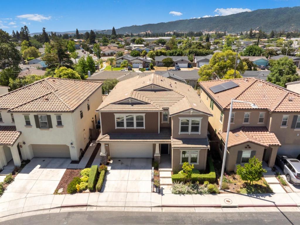 Welcome to 712 Baxter Way, a splendid home nestled in the charming city of Gilroy, CA. This nearly brand-new residence boasts a spacious 2,633 square feet of living space, designed to offer comfort and modern elegance. Step inside to discover an open floor plan that seamlessly connects the living areas, creating an inviting space perfect for both entertaining and everyday living. The kitchen is the heart of this home, featuring a large island that provides ample workspace and a gathering point for family and friends. This property includes four well-appointed bedrooms and three full bathrooms, with the added convenience of a bedroom and full bathroom located on the ground floorideal for guests or multigenerational living. The upstairs loft area is a bonus space that can be adapted to suit your lifestyle, whether you desire a home office, play area, or media room. Natural light floods every corner of this home, creating a warm and welcoming atmosphere. The professional landscaping in the backyard enhances the outdoor experience, offering a serene space for dining alfresco or relaxing on the grass. A key highlight is the privacy afforded by the absence of rear neighbors overlooking the property.