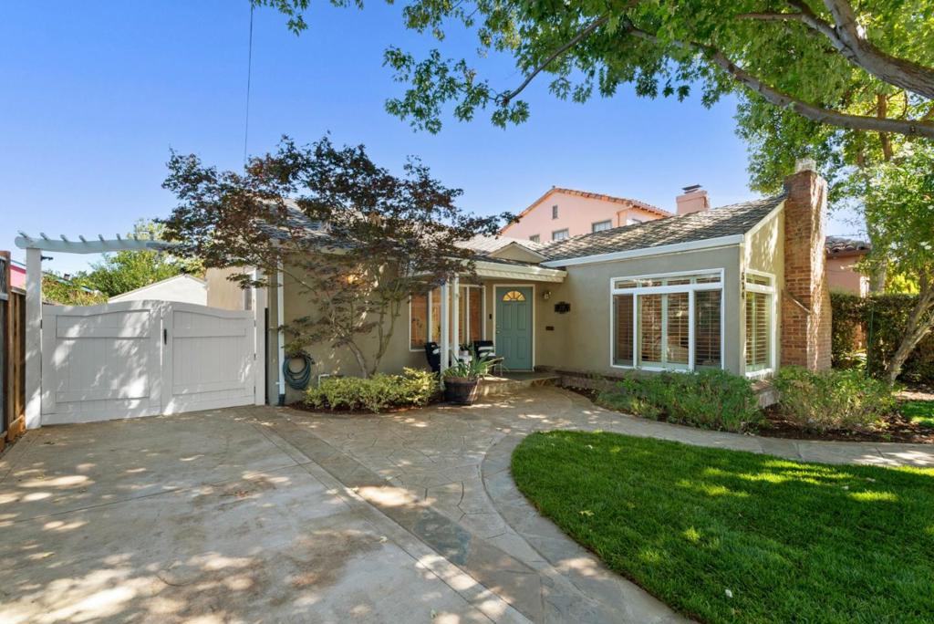 Discover Naglee Park, one of San Jose's most stunning hidden gems. This small, tree-lined neighborhood is peaceful, walkable, and often overlooked, yet just moments from downtown San Jose, San Jose State, parks, and Highway 280. At 534 S 13th Street, a beautifully remodeled 3-bedroom, 2-bath home blends historic charm with modern comfort. The kitchen features quartz countertops, white cabinetry, counter-to-ceiling designer tile, stainless steel appliances, and opens to a spacious dining area. The living room showcases a historic fireplace, while the fully remodeled bathroom offers an oversized walk-in shower and abundant storage. Hardwood floors, plantation shutters, and recessed lighting complete the interior's polished look. Outdoors, enjoy lush lawns in the front and back yards, a hardscape patio for lounging and entertaining, and professional landscaping throughout. A detached two-car garage provides convenience and storage. Offering serenity, style, and surprising proximity, this home is a rare opportunity in one of San Jose's most delightful neighborhoods.