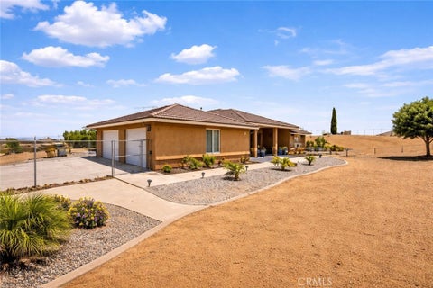 Photo of 6797 Blue Rose Ln, Oak Hills, CA 92344 (MLS # HD26167668)