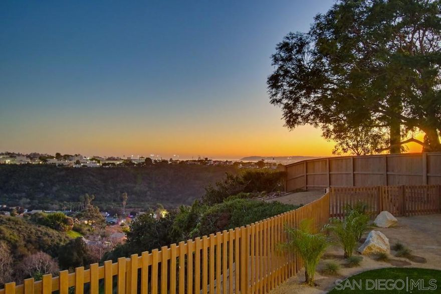Back on Market - Buyer did not perform.  Perched along a quiet, coveted street in prestigious Bay Park, enjoy commanding views of the breathtaking canyon, University of San Diego, bay, ocean, and Point Loma from an elevated, oversized 1/4-acre estate. This exquisitely reimagined residence has been curated from top to bottom, blending refined craftsmanship with timeless sophistication. Every detail has been elevated, including a new roof, dual-pane windows and sliders, new air conditioning system, wide-plank flooring, an upgraded foundation, and a new sewer lateral. The sun-drenched, designer kitchen is a true centerpiece, showcasing custom cabinetry, quartz countertops, bespoke tilework, and sleek, high-end appliances, all flowing seamlessly into a dramatic, view-framed family room overlooking your backyard paradise. The outdoor grounds are equally refined, featuring professionally designed drought-tolerant landscaping, a newly constructed view deck, and an elegant pergola—ideal for private relaxation or upscale entertaining against a backdrop of sweeping coastal vistas. Both bathrooms have been transformed into spa-level retreats with custom designer tile, premium fixtures, and elevated finishes throughout.  A rare Bay Park offering, combining privacy, panoramic scenery, and modern luxury on an expansive lot, just moments from beaches, fine dining, and downtown San Diego.
