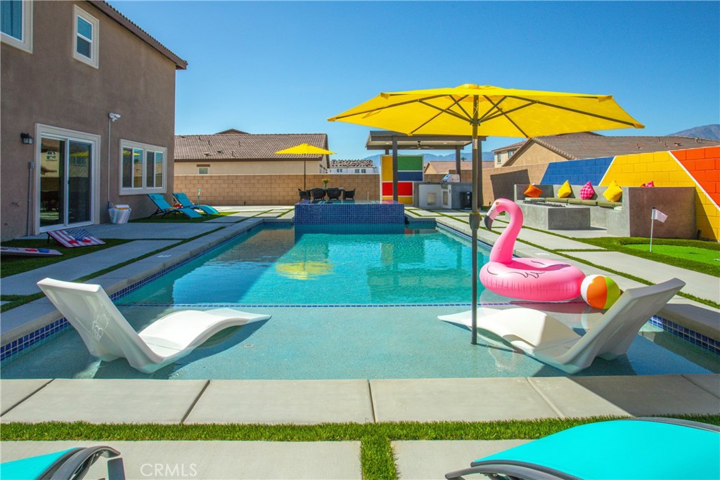 Stunning Coachella Retreat – Built in 2024 by Pulte Homes, this one-of-a-kind residence was designed with style, comfort, and entertainment in mind. Featuring 5 spacious bedrooms, a versatile loft, and 3 contemporary bathrooms, the home sits on a huge lot filled with incredible amenities.
Step inside to an open-concept living area flooded with natural light, showcasing a sleek chef’s kitchen perfect for cooking and entertaining.
Your private backyard oasis is the ultimate retreat—complete with an oversized saltwater heated pool and spa with tanning shelf, ideal for soaking up the desert sun or enjoying peaceful evenings under the stars.
For those who love to entertain, this property is truly unmatched:
Epic indoor game room for year-round fun
Pickleball court, mini golf course, racing track
Outdoor BBQ, dining area, and fire pit for unforgettable gatherings
Additional highlights include solar panels for energy efficiency and long-term savings.
Whether you’re looking for a move-in-ready primary home or a high-return investment property, this retreat checks every box. Conveniently located just minutes from top schools, golf, parks, and the world-famous Coachella & Stagecoach festivals—plus bordering the city of Indio—this property is truly an all-in-one desert paradise.