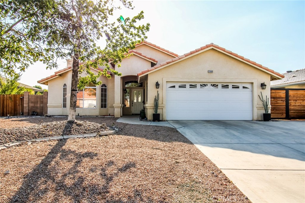 Charming Home in Spring Valley Lake!
Impeccably maintained and perfectly located just minutes from shopping, schools, and restaurants, this home sits in one of the High Desert’s most sought-after communities.
Offering 3 bedrooms, 2 baths, and 1,801 sq ft, the open floor plan boasts vaulted ceilings, abundant natural light, and beautiful wood-look tile flooring. Fresh designer paint and ceiling fans in every bedroom showcase pride of ownership throughout.
The spacious living room centers around a striking hearth fireplace — perfect for cozy winter evenings — while the recently remodeled kitchen is a chef’s delight with stylish finishes, generous counter space, and an ideal flow for entertaining.
Step outside to your backyard oasis with newer turf, a covered patio, gorgeous sunset views, and convenient boat-access parking.
Enjoy the unmatched amenities of Spring Valley Lake: a 200-acre private lake with marina, sandy beach and swim area, community center, multiple parks, 14 fishing spots, and an equestrian center. Sq. Ft. not verified. Information deemed reliable, not guaranteed.