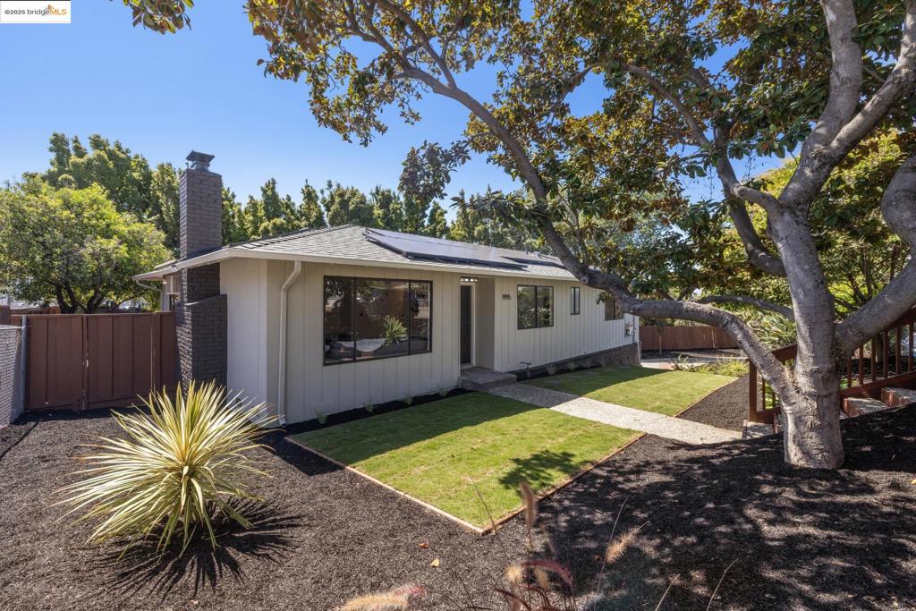 Welcome to this serene hillside retreat in San Leandro, where modern comfort meets natural tranquility. Built in 1966, this charming single-level home offers 2 beds, 2 baths & 1,174 sq ft of living space on an 8,084 sq ft lot nestled in a cul-de-sac lot. The sunlit living room features recessed lighting, stylish floors & a cozy fireplace. A sleek gold fixture elevates the dining area & a large sliding door leads to a back deck, perfect for morning coffee. The 2017-renovated kitchen boasts stainless-steel appliances & generous counter/cabinet space. The primary bedroom offers hardwood floors, a spacious walk-in closet & 2017 renovated en-suite bath. Additional conveniences include an in-unit laundry, AC, solar panels, & a storage basement. Outdoors, enjoy a luxurious hot tub, newly landscaped low-maintenance yard & the expansive level lot is a dog’s paradise with ample parking, ideal for RVs or boats. Also presents potential for expansion or an ADU, subject to local permits & planning. Explore outdoor recreation at nearby Lake Chabot Park, local dining, Century Theater, & farmers market. Centrally located near BART, major freeways, & schools, making this home is hidden sanctuary while keeping the best of the city within reach.