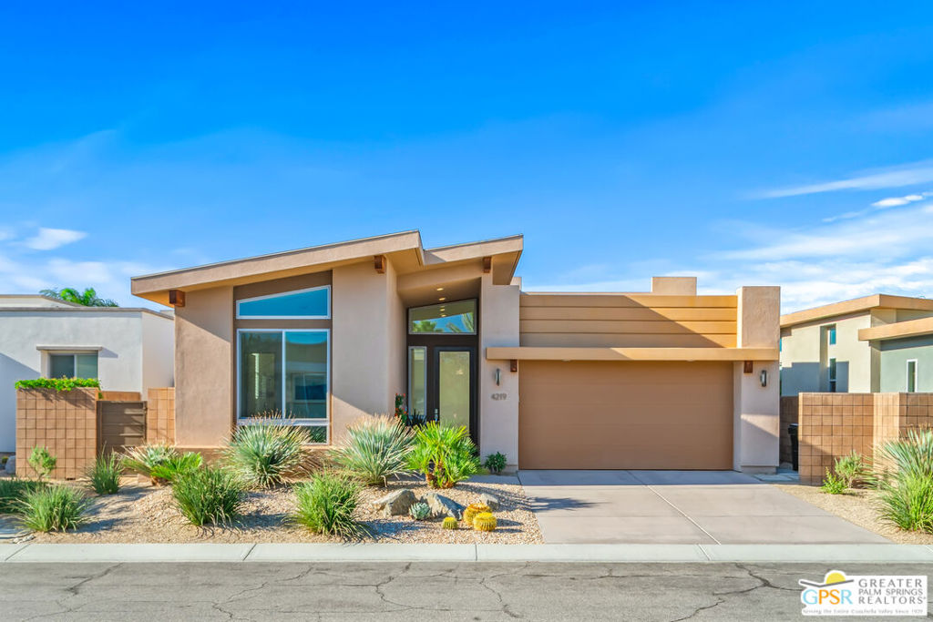 Live the Palm Springs lifestyle at Escena Golf Club, where resort living meets everyday comfort. This like-new, move-in ready Aldea plan has over $25k worth of recent seller improvements that blend the modern design with effortless indoor-outdoor living. Soaring ceilings, clerestory windows, and an open layout fill the home with natural light. The chef's kitchen features quartz counters, custom backsplash, and stainless appliances, flowing seamlessly to the living area with bi-fold doors opening to a private west-facing patio and in-ground spool (spa/pool)perfect for relaxing under the stars. A second covered patio with gas fireplace frames stunning mountain views. The flexible floor plan offers 2 bedrooms + den and 2.5 baths, ideal for guests or a home office. The primary suite includes a California Closet system, dual vanities, soaking tub, and walk-in shower. Energy-efficient upgrades include pre-paid solar, tankless water heater, water softener and filtration, Low-E windows, and custom window treatments. An interior laundry and 2-car garage complete this stylish desert retreat just minutes from downtown Palm Springs.