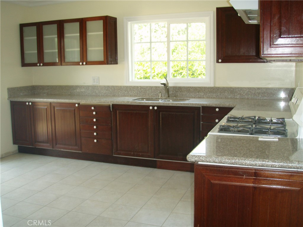 This Wonderful Single-Story Home is Located in a Quiet and Friendly Neighborhood with 2 bedrooms 2 bathrooms. Prime Location Next to Encino & Tarzana! This Cozy Home Has a Private Backyard, Walk-In Closet, Hardwood Floors, Recessed Lighting, Central A/C & Heat, and a Beautiful Kitchen that includes a Stove, Oven, Microwave, and Refrigerator. Laundry Room includes a Washer & Dryer. Gardner included. Private Side Entrance. Most Pets OK with prior owner approval. There are 2 homes on this property; this is the back unit, the front house has a separate tenant.