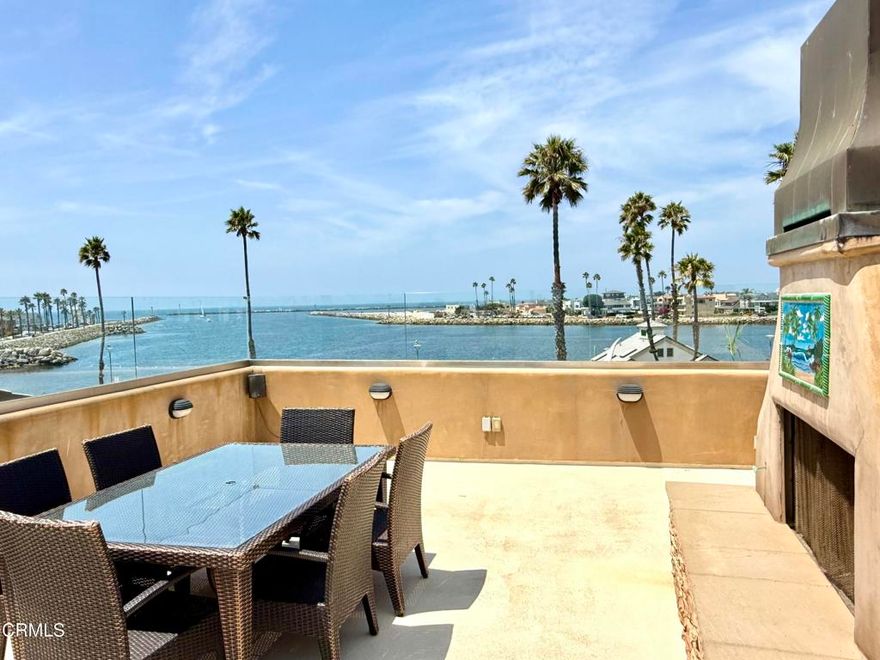 Expansive Water Views!! Discover your private Shangri-La at the entrance to Channel Islands Beach & Harbor--where luxury living meets panoramic ocean, island, and sunset views.This extraordinary 4-level beach home is a masterpiece of design and craftsmanship, offering captivating views from nearly every room and multiple outdoor decks on the 2nd, 3rd, and 4th level.Built with meticulous attention to detail, the home showcases natural stone flooring, solid knotty Alder wood cabinetry and doors, and a grand Brazilian Mahogany staircase that elevates the home's coastal elegance.The first level features a private guest quarters with its own entrance, guest bedroom & bath plus family room, wet-bar, laundry area, ideal for visitors or multigenerational living.On the second floor, soak in even more coastal views from the family room and step out to a view deck with ocean breezes. Entertain with ease at the built-in wet bar or unwind in the spacious guest bedroom and full bath. The primary suite offers tranquil harbor views and a spa-like en-suite bath with an oversized walk-in shower, jetted tub, and double vanity.An elevator provides effortless access to all floors, including the third level, where the home truly shines. Soaring custom wood beam ceilings, dramatic ocean views, and a stunning open-concept living space await. The gourmet kitchen is fitted with Viking Professional stainless appliances and striking granite countertops. The living area, complete with fireplace, flows seamlessly to an expansive wraparound deck--perfect for entertaining or relaxing by the sea.Crowning the home is the fourth-floor rooftop deck, offering 180 views of the beach, harbor, islands and marina. Complete with an outdoor fireplace, built-in BBQ, and refrigerator, this is the ultimate setting for sunset soirees or your own private sky lounge. This view location is a rare opportunity to own a legacy coastal property blending luxury, design, and the very best of beachside living.