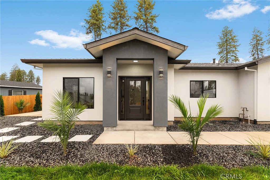 Welcome to this beautiful, newly built modern home with an excellent open layout! Owned Solar!  This single-story residence offers 1,735 sq ft featuring 3 spacious bedrooms and 2 full baths. Enjoy the bright and airy living room with 9-ft ceilings, dual-pane black Milgard windows, and plenty of natural light! The large kitchen includes quartz countertops, soft-close cabinetry, LED lighting, and stainless-steel appliances — refrigerator included! The primary suite features a large walk-in closet, and a luxurious bathroom with dual sinks, a soaking tub, and a walk-in shower. Additional highlights include an electric fireplace, 36-inch wide doors, a 2-car garage, new cedar fencing, and beautiful front landscaping with trees for extra privacy. An excellent opportunity to own brand-new construction on a prime lot!