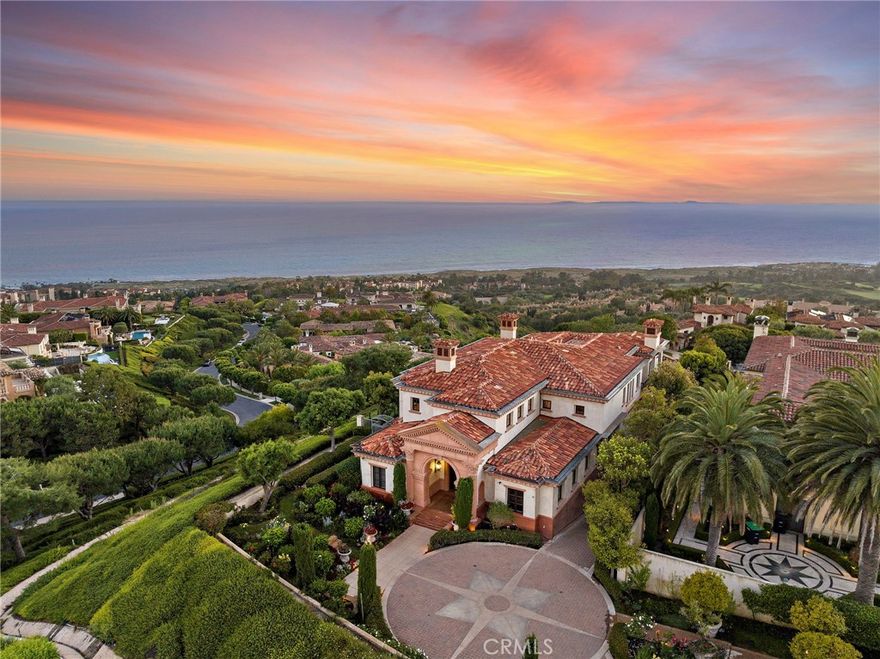 A true trophy location, this custom estate crowns on a premier wraparound lot at the end of a private cul-de-sac in the ultra-exclusive community of Pelican Crest. Perched atop a coastal hill, the residence enjoys commanding, unobstructed ocean views. From sunrise to sunset, immerse yourself in panoramic ocean views stretching from Catalina Island to Newport Harbor and across the glittering skyline, one breathtaking canvas. It opens a world of possibilities that spans all the way to pristine golf greens. The breathtaking shoreline views with year round sunsets and Catalina rest in the back drop. Every inch of this architect-driven, open-concept home has been carefully curated with structure and entertainment in mind. Radiating an encapsulates luxury living at every turn. This meticulously custom built home offering a rare and inviting opportunity intentional, intimate environment where nature's beauty converges with architectural artistry, manifesting as the ultimate sanctuary for harmonious living. Everything fusions with the fresh ocean breeze. The living room draws friends and family together, complete with custom built-ins, and an open floor plan that seamlessly connects indoor and outdoor areas which is perfect for entertaining. Outdoor pool is not only hosting stylish celebrations and delighting esteemed guests, but also for peaceful, present living in a serene and sunset-drenched environment. The upper level is accessed by a dramatic staircase, or by elevator. Jaw-dropping ocean views are found in most bedroom suites. The elegant master suite has its own getaway with a spacious living quarter, featuring ocean views. Down the hall, three additional bedrooms with en-suite bathrooms complete the upper level, ensuring ample space. The fourth car garage is intended for storage, golf cart or small car. This enchanting palatial estate offers complete tranquility, and is the pinnacle of Southern California coastal living that is built to elevate your lifestyle. Must be experienced to truly appreciate its pristine and unparalleled beauty. Welcome to this a once-in-a-lifetime opportunity.
