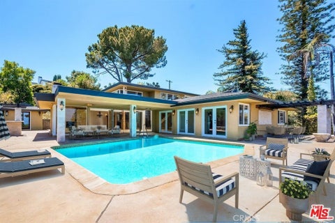 Photo of 3446 Alginet DR, Encino, CA 91436 (MLS # OC26126021)
