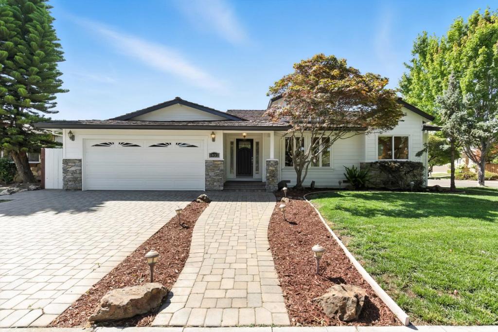 Situated in the heart of Dry Creek, one of San Jose's most sought-after neighborhoods, this beautifully remodeled corner lot home offers airy living spaces that seamlessly blend with serene outdoor areas. This home offers 4 bedrooms, 3 full bathrooms, and over 500 sqft of bonus living space in the finished attic. Gleaming Brazilian cherry floors flow throughout the thoughtfully designed floor plan, complemented by elegant crown molding and three fireplaces. Custom remodeled and expanded in 2008, the home features all-new copper plumbing, a backup generator, and modern upgrades throughout. Beyond the formal living area, you'll find a pristine custom chef's kitchen with Thermador appliances and handcrafted cabinetry, opening into a spacious dining area equipped with a wet bar and a charming brick-lined fireplace. A secondary living space connects to the updated backyard, showcasing meticulous hardscaping, a paver patio, and a spacious turf area. Two primary suites are a true retreat, featuring glass doors that frame the backyard, a walk-in closet, a fireplace, and a spa-like en-suite adorned with Italian porcelain. Located just minutes from Doerr Park, Bagby Elementary, and Price Middle, as well as a 10-minute drive to all local downtown areas: WG, LG, SJ, and Campbell.