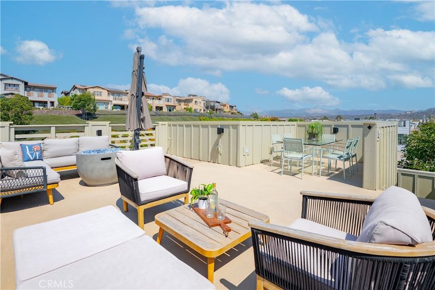 Nestled within the highly sought-after Trellis neighborhood of Esencia, this beautifully upgraded home showcases the community’s largest floor plan, offering three spacious bedrooms plus a versatile office that can easily be converted into a fourth bedroom. Trellis is celebrated for its charming collection of modern farmhouses, perfectly capturing the essence of contemporary South Orange County living. From the moment you arrive, you’re welcomed by a picturesque white picket fence, lush landscaping, and a generous wraparound front porch that sets the tone for the warmth and style found inside. The first level features a thoughtfully designed guest bedroom and a full bathroom, creating an ideal space for visitors or multi-generational living. Upstairs, the expansive second floor embraces an open-concept great room design, where the kitchen, dining, and family room flow seamlessly together. The kitchen has been modernly appointed with quartz countertops, gray cabinetry, stainless steel appliances, a designer backsplash, and durable faux-wood flooring. A custom shiplap wall and Restoration Hardware ceiling fan add stylish character, while the wraparound balcony extends the living space outdoors, providing the perfect setting for entertaining or enjoying the coastal breeze. The primary suite offers a peaceful retreat with a spacious walk-in closet and a luxurious en-suite bathroom featuring dual sinks, a romantic soaking tub, and a walk-in shower. An additional secondary bedroom and bathroom, along with a convenient laundry area, complete this level. The crown jewel of the home is the expansive rooftop deck, an entertainer’s dream with plenty of room for gatherings, relaxation, and taking in breathtaking panoramic views. Blending modern upgrades with timeless farmhouse charm, this residence is a rare opportunity to own one of Trellis’ most desirable homes. Exclusive to Rancho Mission Viejo residents are all amenities in the Villages of Sendero, Esencia, Rienda and future Villages. There are community amenities for all from breath-taking resort-style pools and spas, Esencia school K-8, community farms, fitness centers, guest house, putting green, bocce ball courts, tennis and pickle ball courts, playgrounds, coffee shop, fire pits, an arcade and so much more!