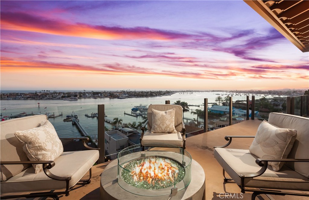 Corona del Mar’s most coveted address—Pacific Drive’s front-row bluff—offers a rare opportunity to experience the pinnacle of coastal living. Perched above the California Riviera, this private residence captures sweeping panoramic vistas: the Pacific Ocean, Catalina Island, dramatic sunsets, the hills of Newport Coast, yacht activity through Newport Harbor, Balboa Peninsula, the Wedge, and city lights stretching to Palos Verdes and Los Angeles. Showcasing timeless Spanish-influenced architecture, the home features 4,380 square feet of bright, open-concept living space, including 4 bedrooms, 3.5 baths, a media bonus room, and a wellness studio. More than 1,500 square feet of patios and terraces span every level including a private spa on the primary terrace.—designed for seamless indoor-outdoor living and entertaining.The chef’s kitchen is finished in limestone flooring, concrete and Calacatta countertops, and top-tier appliances. The entire upper level is dedicated to a primary suite retreat—offering commanding blufftop views, a spa-caliber bath clad in Calacatta stone, an expansive walk-in closet, a flexible wellness or fitness room, and a newly installed private spa overlooking the harbor.Downstairs, a private level offers autonomy for guests or children—creating a flexible layout for modern multigenerational living. Additional upgrades include Tesla charging, bikes, and curated lifestyle amenities.Located within walking distance to Corona del Mar’s finest beaches, Begonia Park, yacht clubs, the Newport Beach Country Club, Fashion Island, village boutiques and dining, and minutes to John Wayne Airport.
Live the dream on Pacific Drive—one of Corona del Mar’s most iconic and irreplaceable blufftop streets.
RATE SHOWN IS FOR LONGER TERM LEASES OF 6-12 MONTHS. THE FOLLOWING RATES APPLY FOR SHORT TERM 1 MONTH $49,500 ///
2-5 MONTHS $44,500.