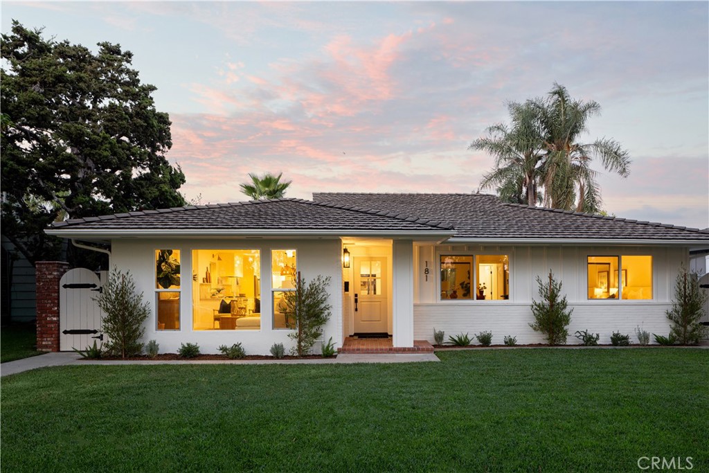 Welcome to 181 Monterey Road, where timeless charm meets luxurious, modern living in the heart of Orange. Meticulously renovated inside and out, this 4-bedroom, 4.5-bathroom home blends style, function, and comfort on a charming tree-lined street just moments from Old Towne Orange and Chapman University. Every detail was carefully curated, from the intentional flow of the floor plan to the hand-picked bespoke lighting, wallpaper accents, and designer tile creating a cohesive, elevated design throughout. Spanning 2,237 square feet, natural light streams into the open layout, thoughtfully designed for both entertaining and everyday living. Wide-plank flooring and designer fixtures run throughout, while the heart of the home, the chef’s kitchen, wows with a striking quartzite island, sleek cabinetry, and high-end appliances. Accordion-style doors seamlessly blend the great room with the spacious backyard, creating effortless indoor/outdoor living. Step outside to enjoy a newly designed landscape featuring mature greenery, seating and dining space, and a modern fence in front that adds privacy and curb appeal. The home offers four spacious bedrooms, including a serene primary suite with a spa-like bathroom, plus 3 beautifully appointed en-suite bathrooms. An added bonus is the spacious detached flex space with a convenient half bathroom—ideal for a guest suite, game room, home gym, or creative studio. A 2-car garage and ample parking add to the home's functionality. From its curated interiors to its resort-style outdoor spaces, this turn-key home delivers exceptional living just steps from the energy of historic Orange.