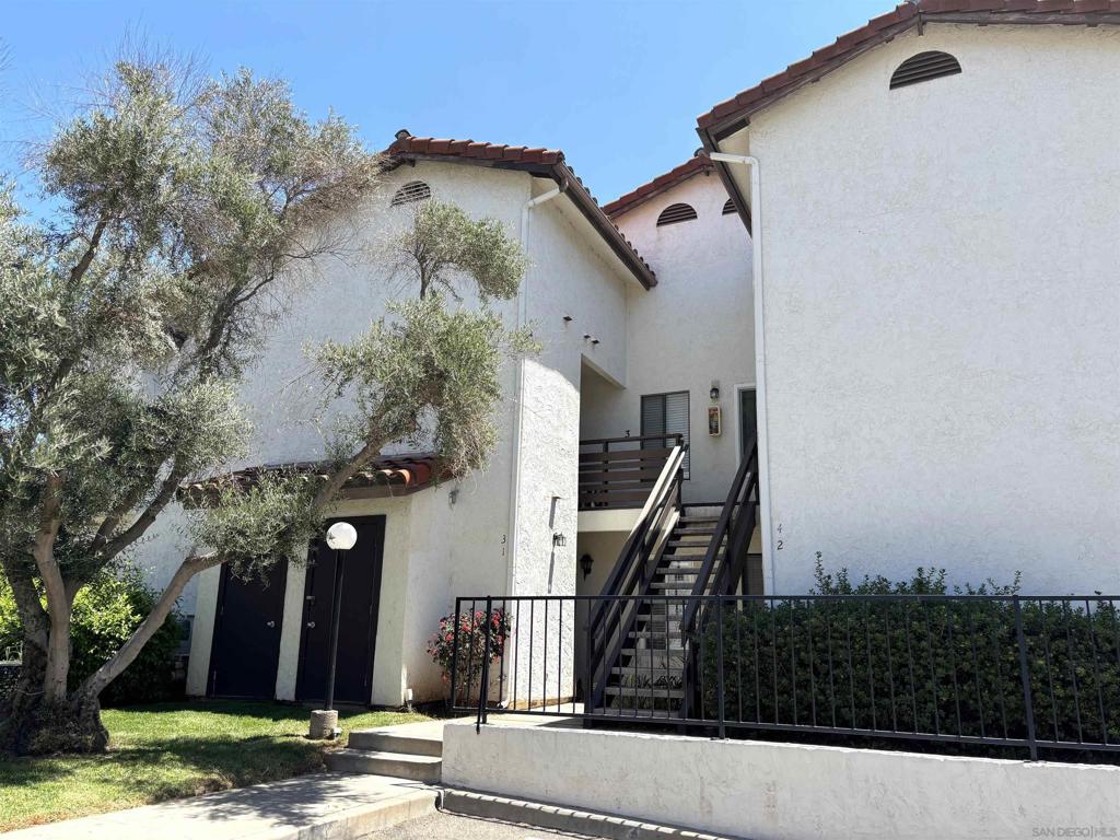 Excellent single level corner unit on first floor at Adobe Hills! Beautifully maintained! DUAL primary bedrooms w/tastefully updated baths! NEWER dual pane windows & sliding glass door! Lovely wood laminate flooring. White kitchen features plentiful cabinetry & NEWER: range/oven, microwave, & dishwasher. Living room w/chic slate fireplace & direct access to your serene & private patio. Stacked FULL sized washer/dryer in unit. A/C! TWO assigned parking spaces (1 covered space & 1 uncovered near patio). Complex amenities include: Large pool & spa, and fantastic clubhouse with full kitchen, perfect for entertaining! Easy access to shopping centers, restaurants, & HWY 15!