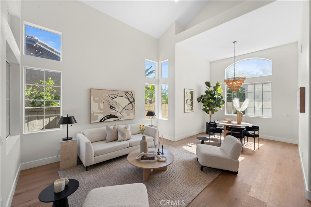 Welcome to your home in the highly sought-after Carmel Mountain Ranch community, perfectly situated near shopping, dining, freeways, and award-winning schools. More than just remodeled, this home has been completely reimagined with high-end designer finishes. This home features a highly desirable layout, including an open floor plan with soaring vaulted ceilings, elegant curved stairs, and a versatile downstairs bedroom with a full bath—perfect for multi-generational living, guests, or a home office. The designer kitchen showcases luxury quartz countertops, slim shaker European-style cabinetry, a handcrafted Zellige tile backsplash, and custom built-in appliances, offering both exceptional functionality and aesthetic appeal. The primary suite presents stunning greenbelt and mountain views, complemented by a walk-in shower with a separate soaking tub, oak vanity, marble flooring, and a spacious walk-in closet. Throughout the home, you'll find new luxury vinyl flooring, fresh paint, recessed ceiling lights, updated modern bathrooms, and new double-pane windows. This home sits on one of the best lots in the community with no neighbors in front or behind, offering exceptional privacy. Additional features include an oversized three-car garage with EV charger, a roof tune-up with a 2-year warranty, low HOA fees, no Mello-Roos, and access to the award-winning Poway Unified School District. Come see this turnkey, designer-crafted home—a top-value property in one of the area’s most desirable neighborhoods!