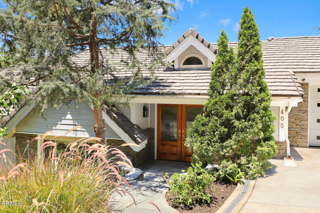 Nestled in North San Rafael and perched above the Annandale Golf Club, this home offers privacy, serenity, and breathtaking canyon views. The home's main level boasts an airy open floor plan, where walls of windows flood the space with an abundance of light and frame the surrounding natural beauty. The spacious living room features high vaulted ceilings with exposed wooden beams and a cozy fireplace, creating a warm and inviting atmosphere. The open-concept kitchen is thoughtfully designed featuring a center island with a built-in wine refrigerator, generous counter space, an adjoining family room, and a delightful dining area that opens onto the deck, which is ideal for relaxed mornings or entertaining guests. A more formal dining area with lovely garden views is right off the kitchen. A few steps above the front entry of the home, a versatile loft space perfect for home office, play area, or library awaits being tailored to your lifestyle needs. Downstairs, you will find three generous sized bedrooms, including a tranquil primary suite with a large ensuite bath, walk-in closet, Cherry wood floors and a private deck with built-in bench. Two additional bedrooms share a convenient Jack and Jill bath, and a laundry room completes the lower level.Exterior decks, newly built with Ipe wood in 2010/2011, offer a peaceful retreat to unwind or host gatherings while taking in the surrounding canyon vistas. With its premium location, thoughtful layout, and seamless indoor-outdoor flow, this is Pasadena living at its finest. Additional highlights include: Maple wood floors throughout much of the home, a generous attached 2-car garage with direct entry into the home, plus a large driveway with space for 3 to 4 more vehicles, perfect for guests or extra parking.