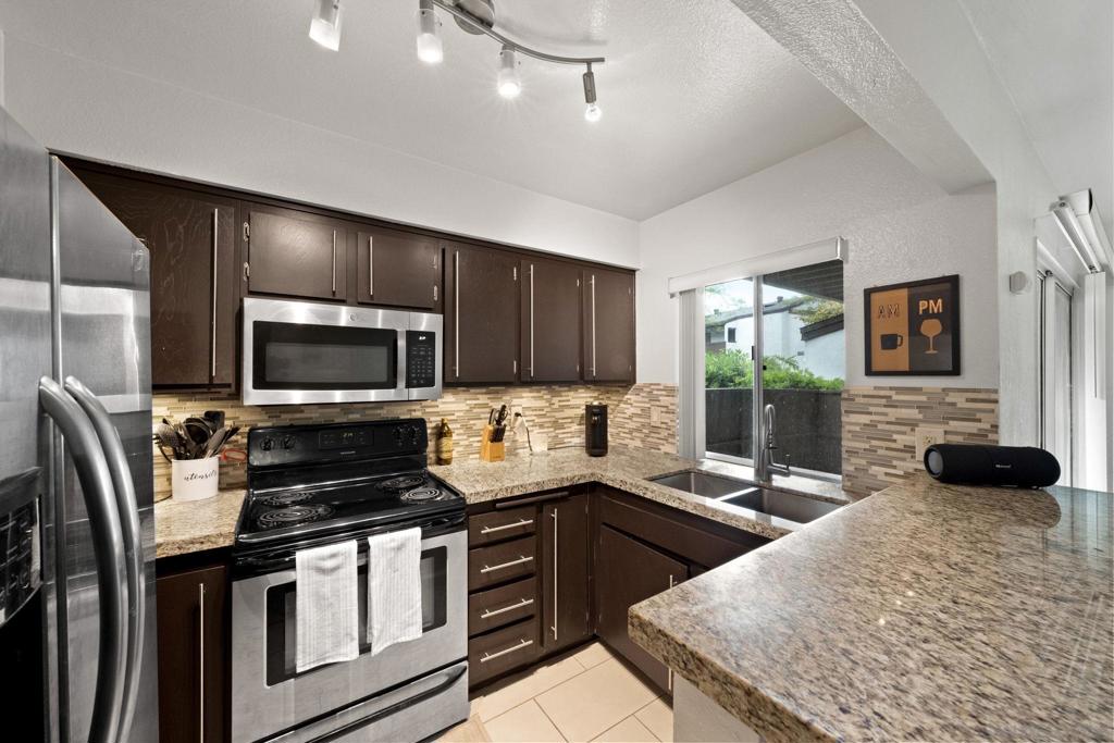 Welcome to this centrally located, FHA and VA approved condo in the heart of Mission Valley. This beautifully updated ground-floor unit offers a spacious 1-bedroom layout with modern touches throughout. Enjoy a remodeled kitchen, stylish updated flooring, and a generous primary suite with plenty of space for a home office or bonus room. Step out to your oversized private patio through sliding glass doors from both the living room and bedroom - perfect for morning coffee or evening relaxation. Tucked away in a quiet, private location in the complex and in close proximity to the pool and laundry area. Park Villas South amenities include two pools, two spas, and BBQ areas for residents to enjoy. Located alongside the scenic San Diego River with walking trails and just minutes from top dining, shopping, freeways, beaches, downtown, and all that Mission Valley has to offer.