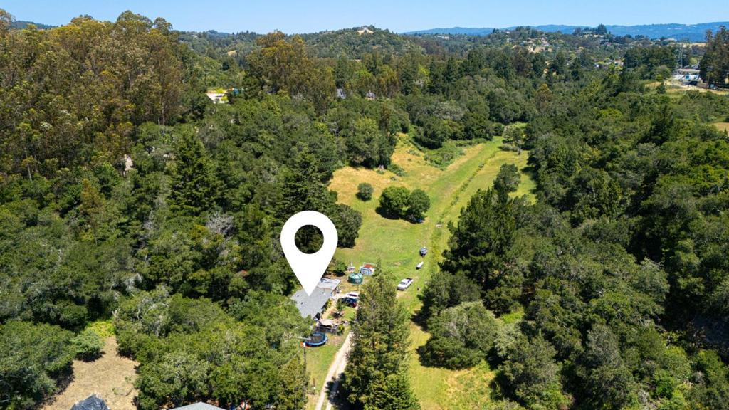 Once in a lifetime opportunity to become the next proprietor of 38 sprawling acres tucked away in its own hidden valley next to Chaminade Resort. It is so rare to find this level of seclusion and privacy while still being in town. The property has 5 parcels with a vast expanse of sunny acreage offering views, solitude, and incredible potential. Preliminary Rural Density Matrix suggests up to 4 potential building sites. An existing vintage cottage is set on a 1.88 acre parcel. The remaining 36+ acres are zoned RA. Property borders Chaminade to the West and Vacant Land (RA-D- Designated Park Site) to the North and East. For an end-user, this rare offering of acreage- so close to town -could be transformed into a legacy estate with the right vision and craftsmanship. For a savvy investor or luxury home builder, this could be the rare gem for which you have been searching. Not to be missed. PRIVATE ROAD- Please do not drive by- showings by appointment only, please do not disturb occupants.