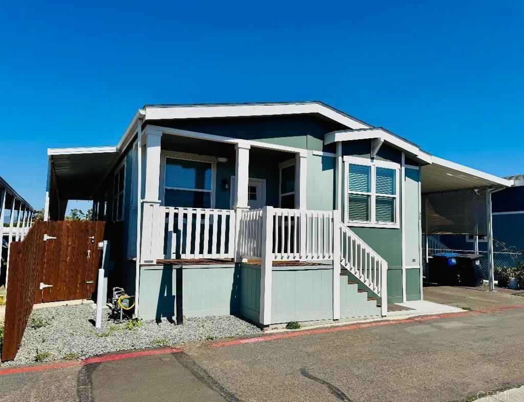 Gorgeous & Spacious Like NEW! 3 Bedroom + 2 Full Bath manufactured home in very desirable La Palma Mobile Estates ALL-AGE community. Home has high flat ceilings, a spacious kitchen with gas cooking, plenty of cabinet and counter space, a large kitchen with a large island for food prepping, and large pantry, separate dining area, laundry room, dual pane windows, fans, front porch, fans, a roomy tiled patio for your enjoyment, carport that could easily fit 3 cars & much more to list! Community offers amenities like a banquet room for your special events, pool, children play area... Home is centrally located, close to grocery stores, malls, restaurants, banks, post office, transportation, 5 freeway, and a short drive to the beach…space rent is $1,000. One of the nicest all-age communities in South Bay that is quaint and charming with lower space rent. Come see this beautiful home today before it's gone!