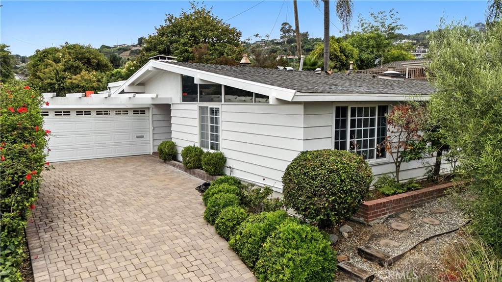 Mid-century modern gem nestled in one of San Pedro’s most private and desirable neighborhoods. This ~2,000 sq ft home features 3 bedrooms, 2 baths, soaring ceilings, two fireplaces, a sunken conversation pit, and tasteful updates throughout. Built in 1955, the home has been freshly painted and offers a seamless indoor-outdoor flow. The backyard is a true retreat with a sparkling pool, above-ground spa, and multiple entertaining areas. Located just blocks from ocean bluffs, trails, Friendship Park, and minutes to the exciting new West Harbor waterfront development. Priced to sell—don't miss this rare opportunity