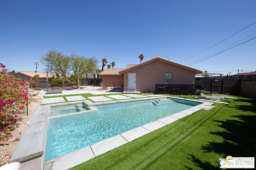 Located in North Palm Springs, a short distance from shopping, dining and nightlife, this updated pool home is perfect for those on a budget seeking a private desert hideaway. Enter this charming home and find an open concept living area with hard surface flooring and an updated kitchen. The three bedrooms are ideally located on opposite ends of the home, which provides the perfect amount of separation for maximum privacy. The outdoor area, complete with custom pool and spa, is an entertainers dream. Host family and friends for poolside parties or just relax in your own desert oasis. This fabulous property is being sold turnkey furnished per inventory list, so just bring your bags and start enjoying the desert lifestyle. Desert Highland Gateway Estates is currently at 6.64% short-term rental permit density, so generating rental income is a possibility too. Don't let this one get away. Schedule your showing today.