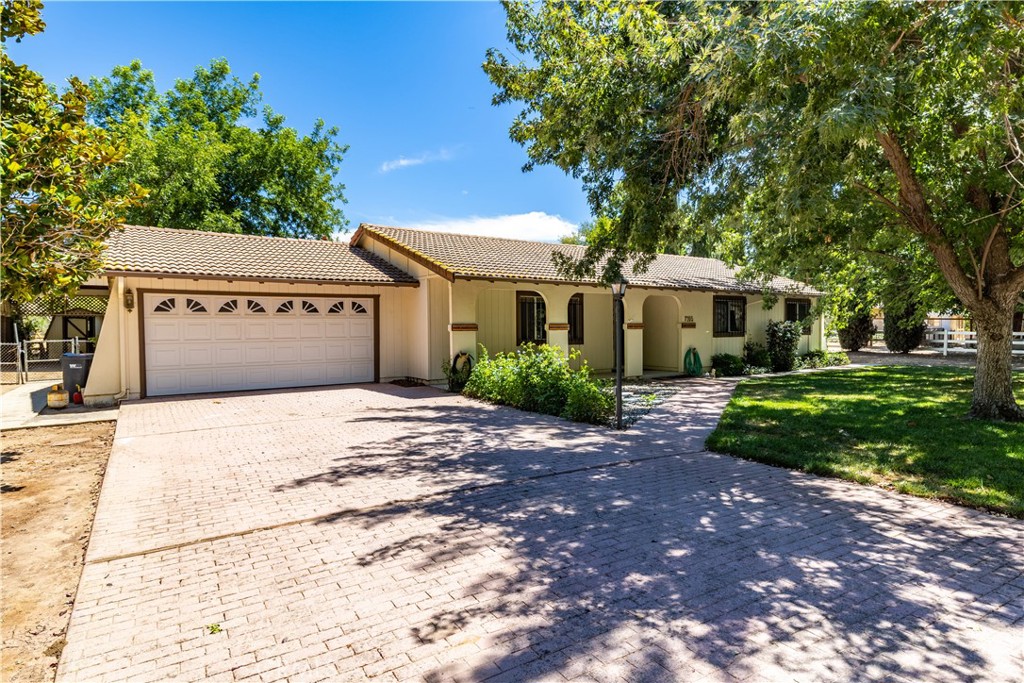 This well located single-story 3-bedroom, 2-bath home on ~1.2 acres offers endless possibilities! Whether you’re dreaming of a peaceful retreat, a hobby farm, a workshop haven, or simply extra space to spread out, this property has the flexibility to make it your own. Inside, you’ll find a cozy living room, built-in bookshelves and cabinetry, plus a sliding door that opens to the covered back patio and backyard. The kitchen has a stainless steel range, ample cabinetry, and plenty of storage plus is open to the living room. Two nice sized bedrooms complement the primary suite, which features its own backyard access, dual vanities, a walk-in shower, and a walk-in bathtub. Outdoors, enjoy the shade of a large covered patio, a lawn, beautiful gardening planters, RV cover, and mature trees. The detached barn includes a 2-car garage door, workshop space, and an upper storage loft with incredible potential. Bordering the Salinas River, this large, level, and usable lot with two driveways is just minutes to the 101, schools, restaurants, and more - this is a property where your vision can truly come to life.