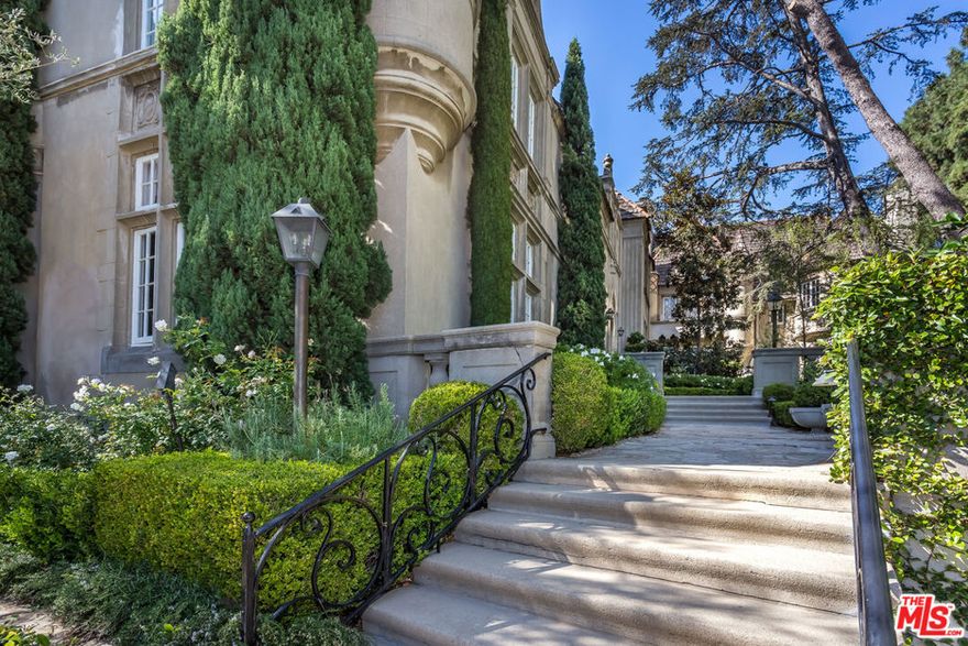 Welcome to Beautiful Chateau Colline!  A 1935 legacy Mansion, once home to Hollywood Royalty Clark Gable and Bette Davis. Designed by Architect Percy Parke Lewis, proudly a member of the National Register of Historic Places, and architecturally important. . This gated enclave has eight coveted condominium homes. This corner home has been recently updated and undergone custom  renovations.  Entry way features Custom Mahogany wood paneling, high vaulted ceilings. The immense Living Room has a beautiful carved mantle over huge fireplace. Serene office/den for private conversations.  Features include kitchen with Viking stainless steel appliances, marble countertops. custom wood cabinetry, Brazilian walnut wardrobe closet organizer in Primary Bedroom. New landscaped gardens and lovely fountains. Close to La Country Club, Bel Air and Century City. Walk to Holmby Park.  Very special serene chateau.  A chic and refined pied a terre!  8,500, Furnished $11,000 per month.