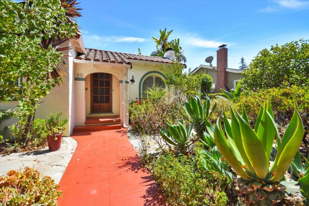 Mediterranean Cottage Charm Meets Modern Comfort in Historic Vendome. Nestled in San Joses storied Vendome neighborhood, once home to the grand Hotel Vendome, this cottage blends timeless architecture with thoughtful modern updates. Surrounded by artisan stone pathways and serene, drought-tolerant gardens, home offers a peaceful retreat that honors its historic roots while embracing contemporary living. Landscaping features native and Mediterranean-inspired plantings including manzanita, agave, succulents, California sage, and Italian cypress. In the backyard, a lush oasis awaits with orange, Fuji apple, plum, lemon, and pear trees, plus Japanese maple, European palm, and thornless blackberries. Inside, enjoy beautiful hardwood floors, a wood-burning fireplace, and a 2bed, 1bath floor plan with the original Art Deco bathroom design. Home offers a partial basement, a detached garage. Upgrades include a new roof with Palermo clay tiles, and custom copper & brass leader head with downspout; fresh exterior and interior paint; new attic insulation and a new hot water heater. Walking distance to San Pedro Square, light rail, and close to SJ Int. Airport and freeways, this home offers both the tranquility of a garden retreat and the convenience of a connected city lifestyle.
