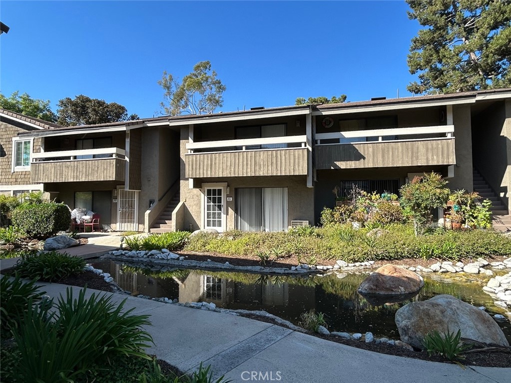 Welcome to 262 Streamwood, nestled in the Northwood neighborhood of Irvine. This upper-level unit features vaulted ceilings and a peaceful view of the community pool and stream. Inside, you'll find a bright and functional layout designed for comfortable living. The community offers amenities including a swimming pool, spa, tennis courts, and clubhouse. You'll also enjoy easy access to the community laundry room, assigned carport parking, and eco-friendly EV charging stations. Conveniently located near shopping centers, parks, and Top-rated Irvine schools, this home is ideal for those seeking both comfort and location. Enjoy a newly updated kitchen with a brand-new refrigerator and fresh paint throughout the home-making it truly move-in ready!