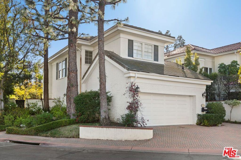 WOW!! WOW!! Offers due after first Open House 8/10/25. Incredibly priced country club custom designed home in 24HR Guard Gated - THE RIDGE enclave in Mountain gate offers a one of a kind floor plan with 3 levels and Mountain & Tree-top views 3 spacious BR's including huge primary suite with multiple closets and large walk-in closet + a convertible 4th BR/Office/Den on the second floor. Third floor is like a mini primary bedroom with it's own, private and spacious terrace overlooking the pool area. Lots of closet space and storage throughout. Prime end-unit location with wrap around patios and total privacy. Designer finishes throughout, new roof and large living room with ethanol burning fireplace, opens out to resort like backyard with large entertaining spaces, lovely gardens and seating areas. 2-car direct-entry garage w/220V electric charger. Park-like amenities-Community Pool/Spa & glorious hiking trails in the SM Conservancy. Contact agent for HOA insurance and additional coverages. Finest resort-like living in LA-easy access to 405fwy, UCLA, USC & the Westside's best shopping+dining. Walk to Mountain gate Country Club which offers golf, tennis & social memberships. This is a townhome in a condominium project.