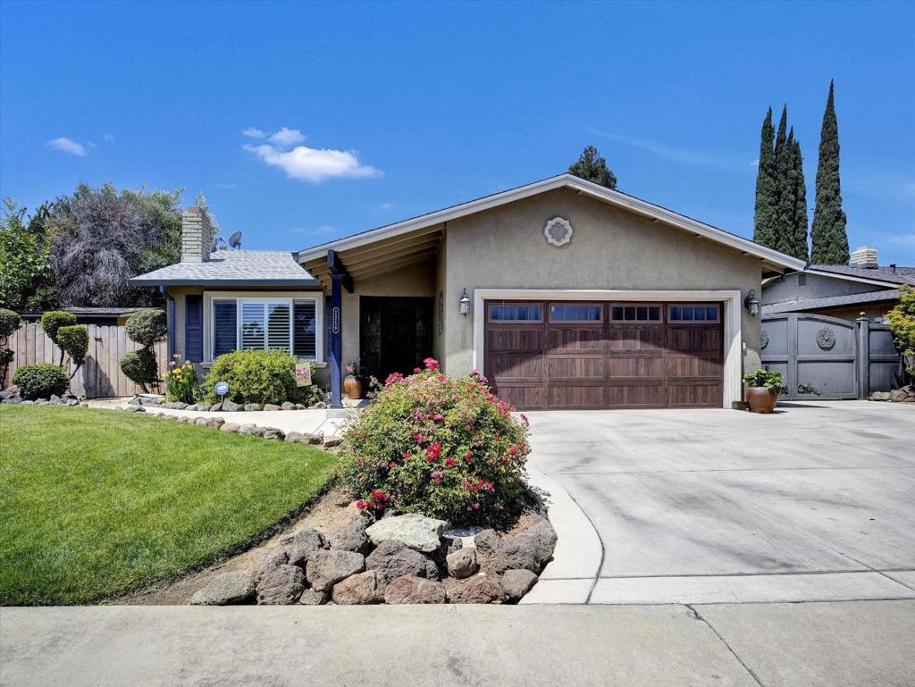 Welcome to this charming home located in the vibrant city of Lodi. With 1,957 square feet of living space, this 4 bed, 3 bath property offers a comfortable and inviting environment for families. The updated kitchen is a true highlight, featuring high-end, modern appliances including a gas cooktop, double oven, dishwasher, and microwave. Granite countertops and a pantry provide practicality and style. Flooring throughout the home includes elegant hardwood and tile, contributing to a warm and stylish atmosphere. A fireplace adds additional charm and warmth to the living space. The home includes 3 full bathrooms, with updates such as marble and granite finishes, double sinks, and an oversized tub. There is also a flexible 5th room with its own exterior entrance that can serve as an office, den, or additional bedroom to suit your lifestyle. Additional amenities include multiple walk-in closets for ample storage space. The property also boasts a central AC for cooling and central forced air heating. A brand-new roof was just recently completed. The large side yard is perfect for RV/Boat parking behind the large double gates. A 2-car garage gives this home plenty of parking options. The amenities of this beautiful home combines functionality and comfort.