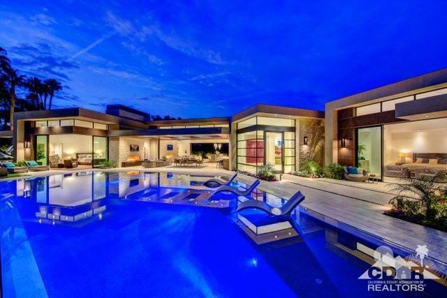Newly built & designed by Phantom Development in 2018 this home delivers contemporary architecture w/soaring 15'6'' high ceilings, clerestory windows & retractable glass doors to allow the indoor-outdoor experience that begins w/ an abundance of natural light throughout. The single level curb to fairway floorplan begins w/ the first of two outdoor living spaces. The gated entry courtyard offers views of the majestic mountain that lies beyond,a dramatic negative-edge pool & spa, sun bathed patios & a covered patio w/ skylights, fireplace & sit-down bar that lead into the living space of home's great room. The lot is perched above the 6th Green of the Mountain Course. Contact Agents for more details.