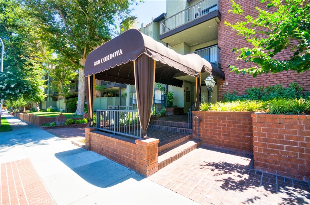 Refined contemporary luxury is on full display in this tri-level townhome where turnkey comfort waits to welcome you home! Bright, breezy, and beautifully appointed, 330 Cordova #301 enjoys a coveted location in the heart of Pasadena just south of the Paseo. Stepping inside you'll find the elegantly designed main-level. The entry foyer boasts a soaring ceiling and a stylish powder room is conveniently placed nearby. A hallway leads to the living and dining room where light pours through multiple windows and a sliding door opens to a balcony with vibrant city views. With a handsome fireplace, this space is great for entertaining or unwinding! Off the dining room, access to the spacious, updated kitchen is sure to impress with gleaming stone counters, ample cabinetry, and name brand stainless appliances. There is a comfy breakfast nook as well. On the top level, rests an expansive loft space featuring a 2nd balcony while the bedrooms are placed downstairs on the bottom level. Downstairs is the generous primary suite with multiple large closets, a fireplace and direct access to the primary bath, stone counter with sink and a soaking tub and walk-in shower. There is an additional good size BR and a well-appointed hall bath with a walk-in shower as well as a laundry room with side by side W/D. It also has 2 side by side parking spaces and a storage space in the garage. The complex has done massive upgrades over the last 5 years and has an inviting pool and spa, updated gym and a large room with billiards and a kitchen perfect for parties or as a common meeting room. There is also on-site property management M-F and a large guest parking garage which is hard to find in Pasadena. The complex is close to Old Town, the Metro Gold Line, Trader Joe's, the Paseo, multiple freeways, dining, shopping and entertainment options. You truly can't beat this location as you are close to everything in Pasadena! Don't miss this opportunity as a unit with these attributes doesn't come along that often!