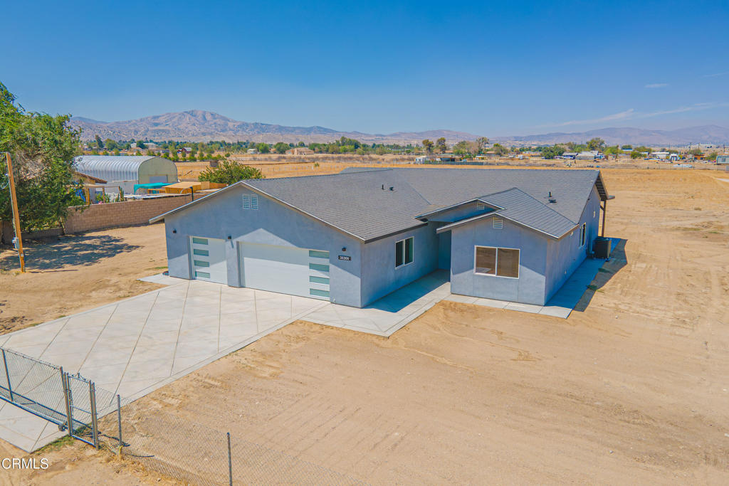 Brand-new, all-electric Contemporary Ranch on a flat 2.3-acre lot with owned solar. Offering 1,878 sq ft, 4 bedrooms and 3 bathrooms--including two primary suites--this home is built for modern living. The open kitchen centers on an oversized island with seating and generous storage, flowing to the living/dining areas for easy entertaining. Each bathroom features tiled walls for a clean, durable finish. Enjoy a gorgeous rear attached patio, plus an attached 3-car garage for vehicles, toys, and tools. Room to spread out--bring your RV, plan a workshop, or explore future additions (buyer to verify). Move-in ready efficiency with the savings of owned solar.