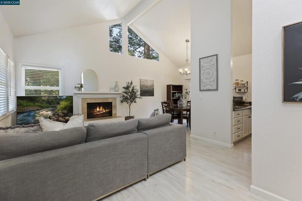 Discover this delightful upper end-unit in the desirable Shadowood community, offering a peaceful, Tahoe-like setting among the redwoods. Step inside to vaulted ceilings and abundant natural light streaming through dual-pane windows. The updated kitchen features white cabinetry, granite counters, a Bosch dishwasher, and a newer electric range. Both bathrooms have marble walk-in showers, frameless glass doors, marble flooring, granite vanities, and contemporary bowl basins. Enjoy outdoor living on the deck—perfect for a barbecue, a cozy seating area, and extra storage. Additional features include an in-unit washer/dryer, central heating and A/C. Shadowood residents enjoy amenities including a pool, clubhouse, and tennis courts. Centrally located near dining, shopping, Diablo Valley College, and major freeways—this home combines tranquility with convenience.
