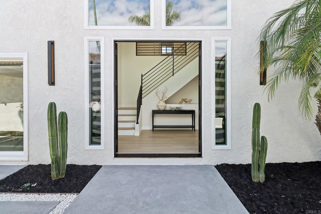 Here is your opportunity to own this magazine-worthy, contemporary home featuring 5 spacious bedrooms, 4 bathrooms, and a sparkling pool, perfectly designed for modern family living and entertaining. Step through the private courtyard entry into a grand foyer that exudes style and sophistication. With multiple entertaining spaces, soaring ceilings, and chic designer finishes throughout, this two-story residence is truly one-of-a-kind. Enjoy the ideal family floor plan with two full bedrooms on the main level and three bedrooms up, offering flexibility for guests, multi-generational living, or a private home office. The outdoor living spaces are equally impressive, featuring a sparkling pool with two Cantina Style folding doors for year round indoor/outdoor entertaining. The master suite is a retreat beyond compare—a luxurious haven that rivals a five-star resort, complete with spa-inspired bathroom, oversized walk-in closet, and a separate sitting area. Every detail of this home has been elevated with super high-quality upgrades, creating an ultra-chic and sophisticated environment. Located in the desirable Del Cerro community, you’ll be close to top-rated schools, scenic parks, Cowles Mountain hiking trails, and Lake Murray. This is unbelievable value for such a high-end, move-in ready home. Don’t miss your chance to live in true style—this one is a must-see and will not disappoint!