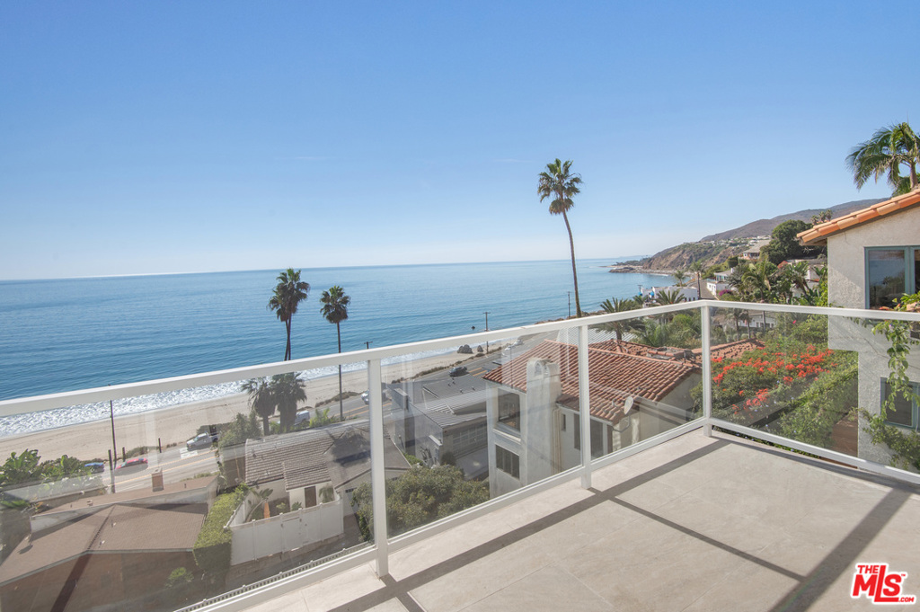 This spectacular, contemporary home is situated in the highly desired enclave known as Castellammare and has been completely remodeled to maximize the extraordinary, unobstructed coastline views stretching from Palos Verdes to Point Dume, Malibu. This double lot offers a unique opportunity to have an ocean-view pool that overlooks the lower flat turf yard, half basketball court, fire-pit, and sitting area. High ceilings and abundant natural light fill the home throughout. The entry level comprises of the main living areas and designer kitchen, and 2 car garage. Upstairs is a dedicated master suite with fireplace, a separate office area with step out balcony and private staircase down to the street, a walk-in closet, and stunning master bath. All positioned to capture the 180 ocean/city light views. The lower level has 2 en suite bedrooms and a large entertainment room/ w/ a wet bar. (The 2 properties run street to street and include 17804 = home and 17803 Porto Marino = vacant lot).