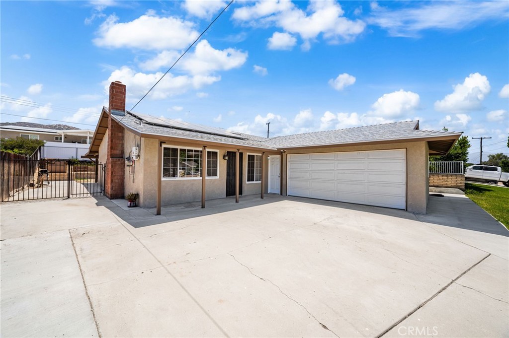 Welcome to this charming 3 bed / 2 bath single-story home on a quiet Norco Street, offering a perfect blend of comfort, upgrades, and location. Step inside to find new carpet and tile flooring, an updated bathroom, and energy-efficient dual pane windows and sliders throughout. The home features a new roof and an owned solar system delivering long-term savings. Outside, enjoy a full-length covered patio perfect for entertaining, a side yard ideal as a dog run, and a multi-tiered backyard with plenty of potential for landscaping or customization. An oversized playhouse can stay which adds that extra charm for families. With top-rated schools, parks, shopping, and freeways all nearby, this home offers both convenience and lifestyle in the heart of Norco. Solar to be paid off at Close of Escrow.