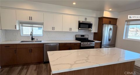 Photo of 1418 S Cloverdale Avenue, Los Angeles, CA 90019 (MLS # PW26037040)