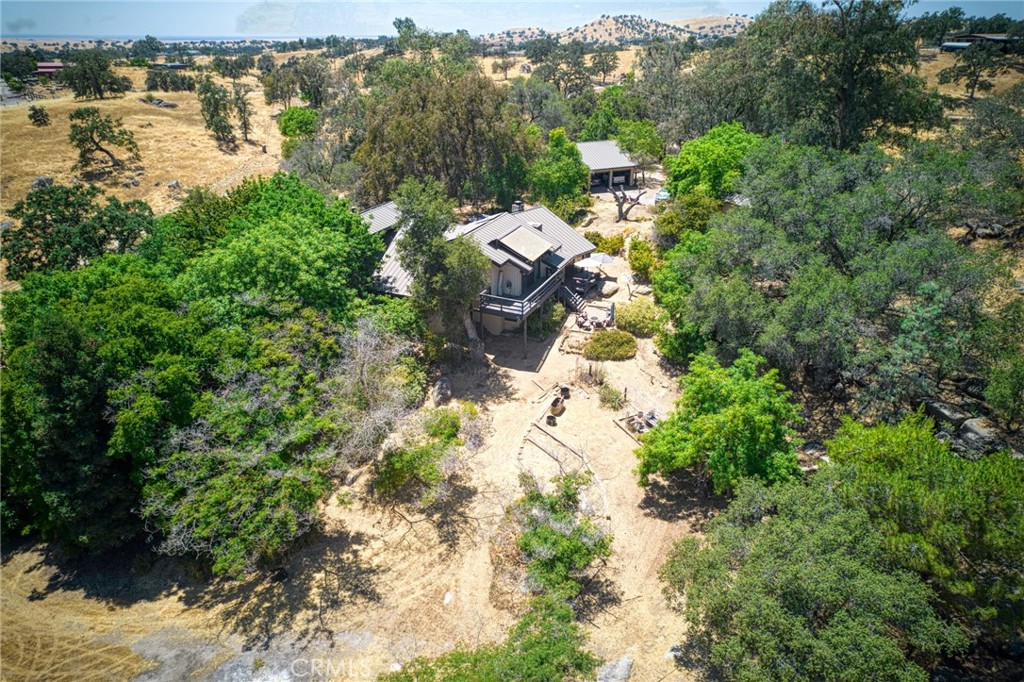 Spacious Custom Ranch Home on 19 Acres - Priced Below Market Value!
Positioned on a 19 private acre corner lot, this custom-built 3-bedroom, 3-bath ranch-style home offers over 3,500 sq ft of living space with room to grow, create, or expand. Redwood tongue-and-groove paneling and a dramatic floor-to-ceiling stone fireplace bring warmth and character to the large great room, while separated bedroom wings make multi-generational living or flexible use effortless.
The lower-level family room with new LVP flooring and a wet bar opens up even more options for entertaining or relaxing. Outside, mature landscaping provides a shaded oasis, while the expansive property offers potential for livestock, horses, or creating your own ranch setup.
Additional features include:
Owned solar system
Whole-house generator
Large detached 3-door garage with workshop space
Quiet, private setting with plenty of space to stretch out
With solid custom construction and unique character throughout, this property is ready for your personal touch and vision. Perfect for those looking for space, privacy, and opportunity in a ranch-style setting.