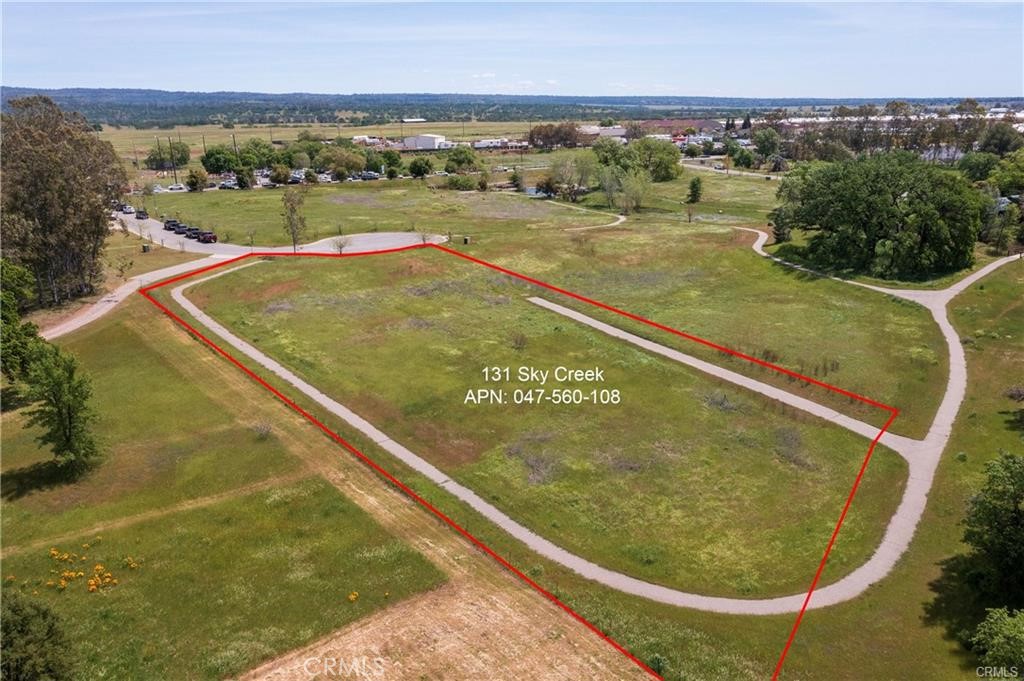 A 1.14-acre lot zoned for light industrial use is now available for development near the Chico Airport. Located in a fully improved complex, the property includes access to public utilities, paved streets, curbs, and gutters. Enjoy natural amenities such as walking paths and picturesque creek views. Whether you're planning to build your own facility or looking for a promising investment opportunity, this lot offers exceptional potential.