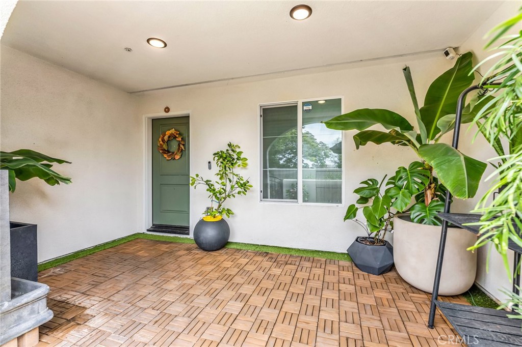 Welcome to contemporary living at its finest with this stunning three-level townhome, built in 2023. Located in a gated, pet-friendly community that boasts a BBQ and picnic area, a secured package delivery station and ample guest parking. This property is in turnkey condition, ready for you to make it your home. The first level welcomes you with a spacious private front patio, perfect for outdoor relaxation. Inside, you'll find a convenient bedroom and bathroom, along with access to the garage. The second level is the heart of the home, featuring a great room with a living room, kitchen, and dining area, as well as a half bathroom. The kitchen is a chef's dream with a large island, stone counters, and stainless steel appliances. Step outside the living room onto a large covered lanai and enjoy the seamless indoor-outdoor flow. The third level hosts both the junior suite and the luxurious primary suite, offering privacy and comfort. This eco-friendly home is equipped with leased solar panels, providing energy efficiency in style. Experience modern townhome living at its best! FHA AND VA APPROVED COMMUNITY