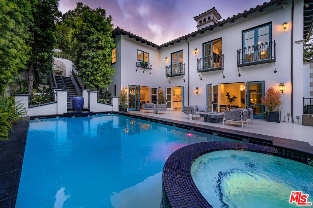 A spectacular gated and private Contemporary Mediterranean style estate on prime Tower Road north of Sunset. Completely renovated from the ground up with top of the line finishes. Soaring ceilings throughout and walls of glass provide sun-filled living and an impression of great volume.  Generous and sun-filled dining, kitchen, and family rooms. An absolutely incredible Master Suite featuring towering ceilings, stunning master bath with soaking tub, and dual walk-in closets. Most rooms have views to the home's 5 Star resort-like grounds, complete with Italian gardens and courtyard, outdoor entertaining areas, and a sparkling pool and waterfall. A state-of-the-art screening room and gym enhance this luxurious residence. With parking for up to 7 cars, this is a rare and special offering on one of best and quietest streets of Beverly Hills. Amenities include elevator, security system, Control4 Home automation, and more. Priced far below its appraised value and easy to show with sufficient notice.