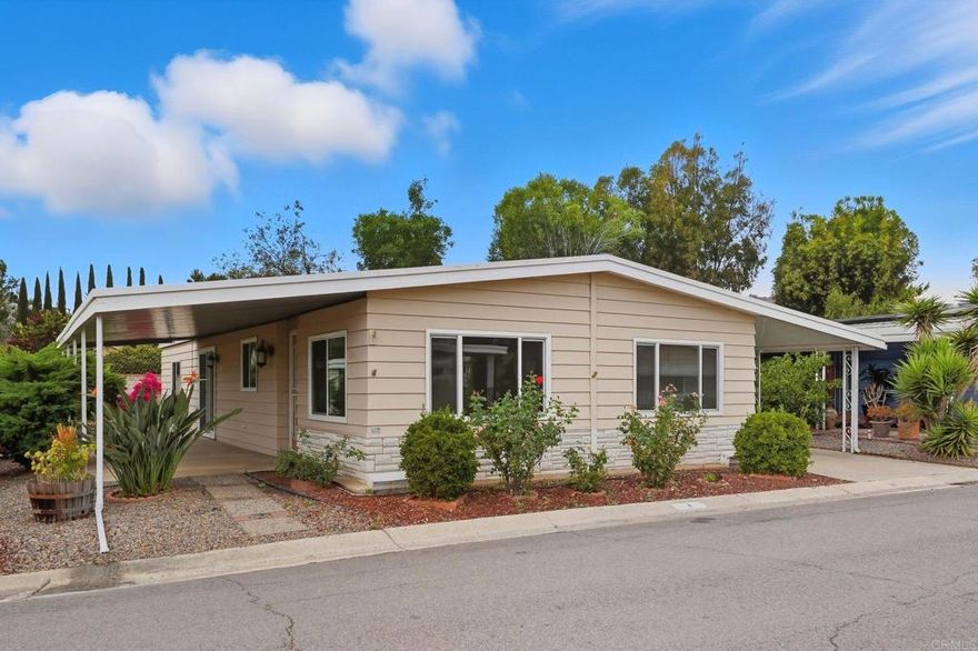 Beautifully Renovated 2-Bedroom Home in Sundance Mobile Home Park!  Welcome to this fully remodeled double-wide, thoughtfully designed to combine comfort and style. When you walk through the door, the open-concept living area immediately feels welcoming, with space that flows naturally for both relaxing and gathering. The kitchen sits at the heart of the home, with quartz countertops, matching new appliances, and generous cabinet space—ready for weeknight dinners, weekend baking, or sharing a meal with friends.  Off the kitchen, the family room offers a built-in media desk and flows seamlessly to the covered patio, creating the ideal space for indoor-outdoor living. Both bathrooms have been beautifully upgraded with custom tiled showers, quartz vanities, and a relaxing soaking tub. The spacious primary suite provides a true retreat with luxury finishes at every turn.  Additional highlights include complete re-piped plumbing, waterproof flooring, new windows, covered parking for two cars, and a large storage shed. This home is fully turn-key and low-maintenance!    Set in the highly desirable Sundance Mobile Home Park, a welcoming 55+ community with resort-style amenities: clubhouse with kitchen, heated pool, jacuzzi, fitness center, saunas, library, billiards, shuffleboard, and lush greenbelts. Conveniently located minutes from shopping, dining, and entertainment.   Don’t miss your chance to own this beautifully updated home in one of North County’s premier retirement communities. Schedule your private showing today!