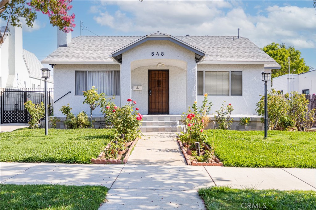 Spacious and very pleasant home located in the City of Glendale. 3 bedrooms, and 2 bathrooms also includes a bonus room which is being used as a bedroom .Beautiful hardwood floors in bedrooms and living room. Kitchen with beautiful tile and dark oak cabinets. Home has complete new roof,rear of home has ADU. Upgraded electrical for complete home.Seperate laundry room at rear of home with small kitchen. Central heating and air.